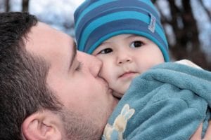 Man kissing baby