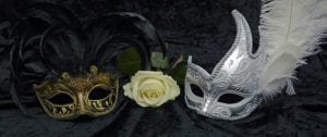 Two masks on a dark background