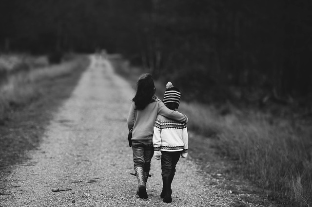 Kids walking down gravel road