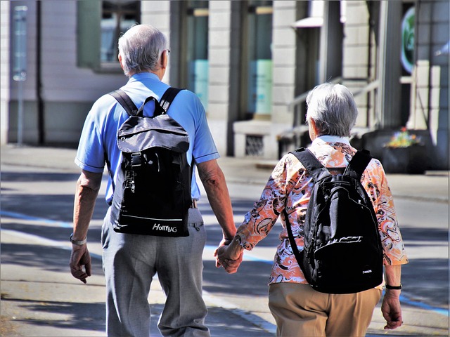 An older couple walking together and holding hands, symbolizing a marriage that has lasted a long time.