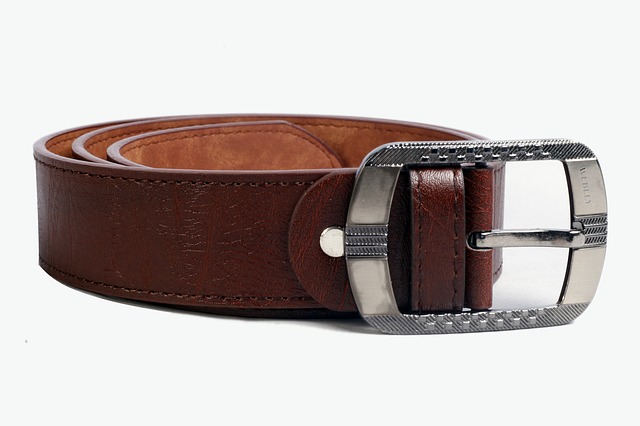 A picture of a leather belt rolled up with the buckle visible, which symbolizes the idea of spanking as a method of discipline.