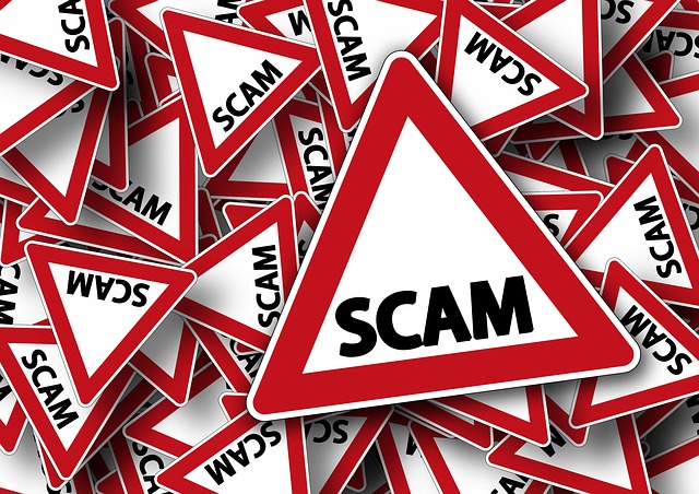 A pile of signs, all saying the word "scam"