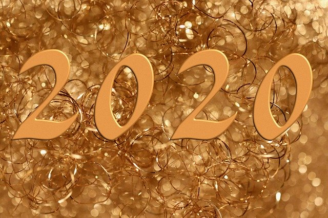 The numbers '2020' in gold against a backdrop of golden sparkles, celebrating the new year.