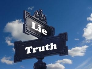 A sign post with the words 'lie' and 'truth' on each side