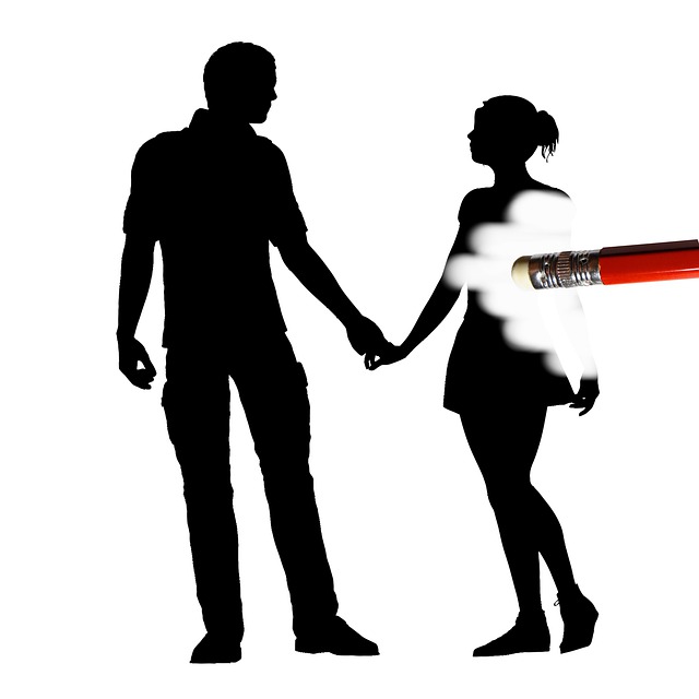 A silhouette of a man and woman holding hands, but she is being erased slowly.